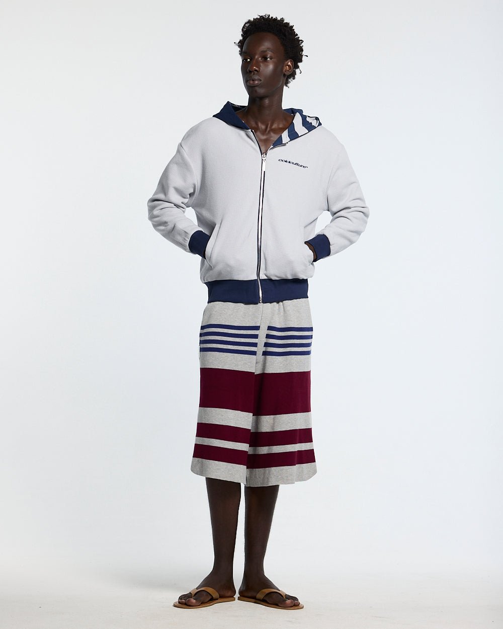 UNTRUE WAFFLE REVERSIBLE ZIP HOODIE BLUE - navy striped reversible zip-up hoodie, front view on male model - Cold Culture #man