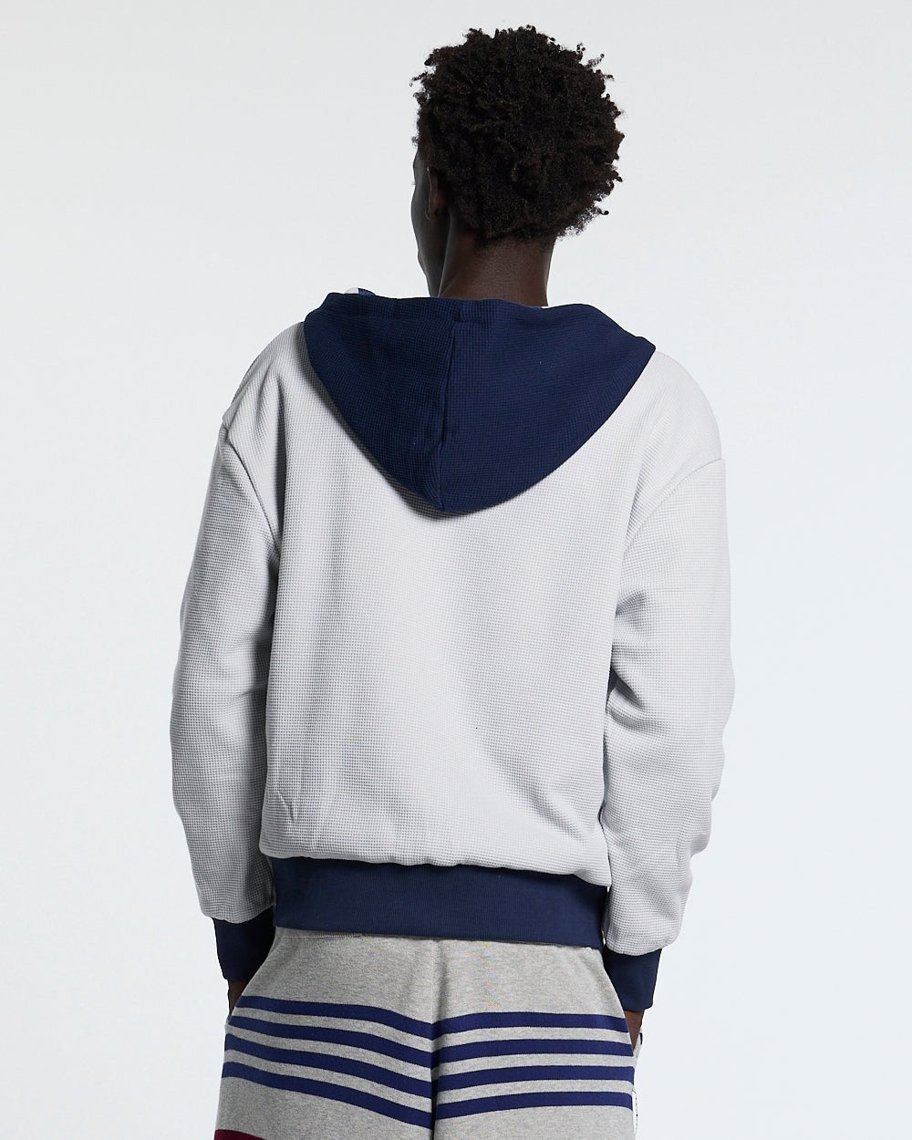 UNTRUE WAFFLE REVERSIBLE ZIP HOODIE BLUE - navy striped reversible zip-up hoodie, back view on male model - Cold Culture #man