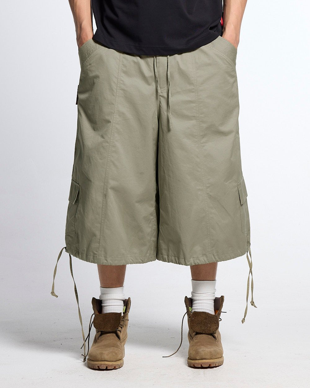 UTILITARY CAPRI PARACHUTE CREAM - khaki cargo capri shorts, front view on male model - Cold Culture