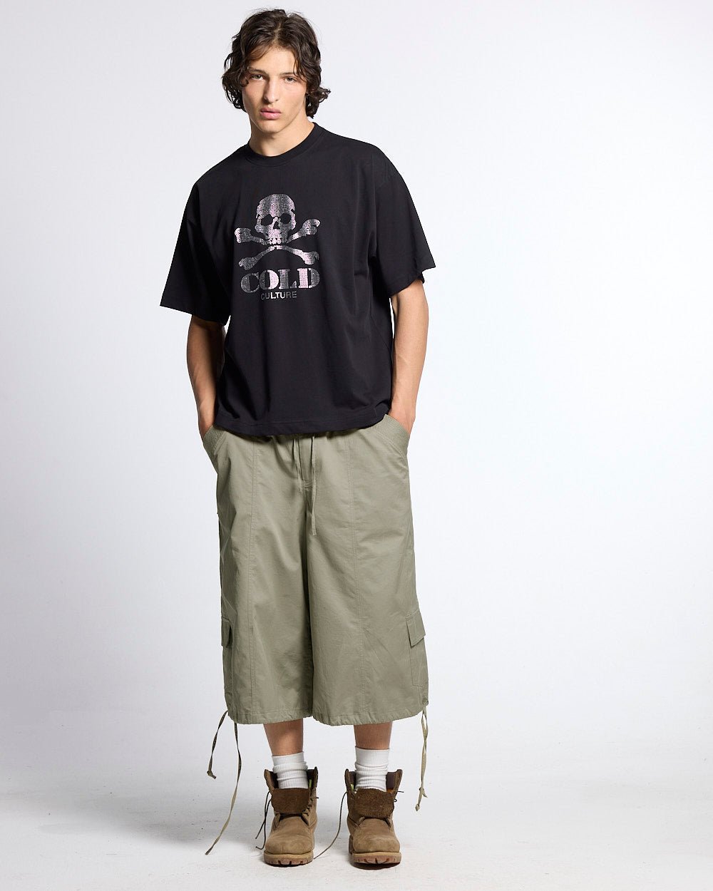 UTILITARY CAPRI PARACHUTE CREAM - khaki cargo capri shorts, front view on male model - Cold Culture #man