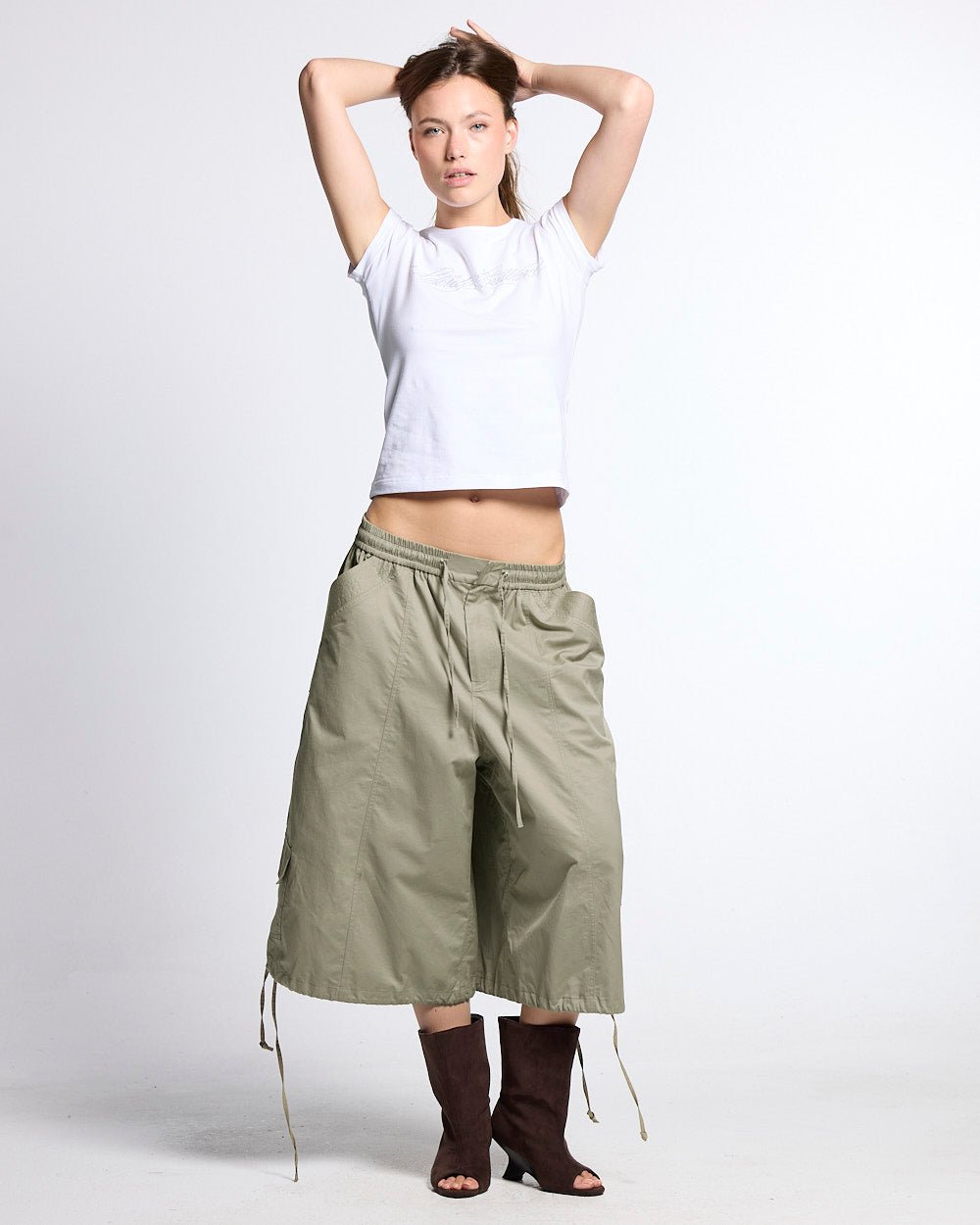 UTILITARY CAPRI PARACHUTE CREAM - khaki cargo capri shorts, front view on female model - Cold Culture #woman