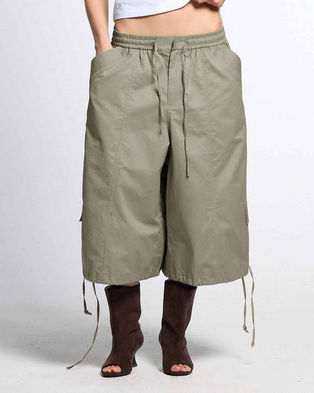 UTILITARY CAPRI PARACHUTE CREAM - khaki cargo capri shorts, front view on female model - Cold Culture #woman