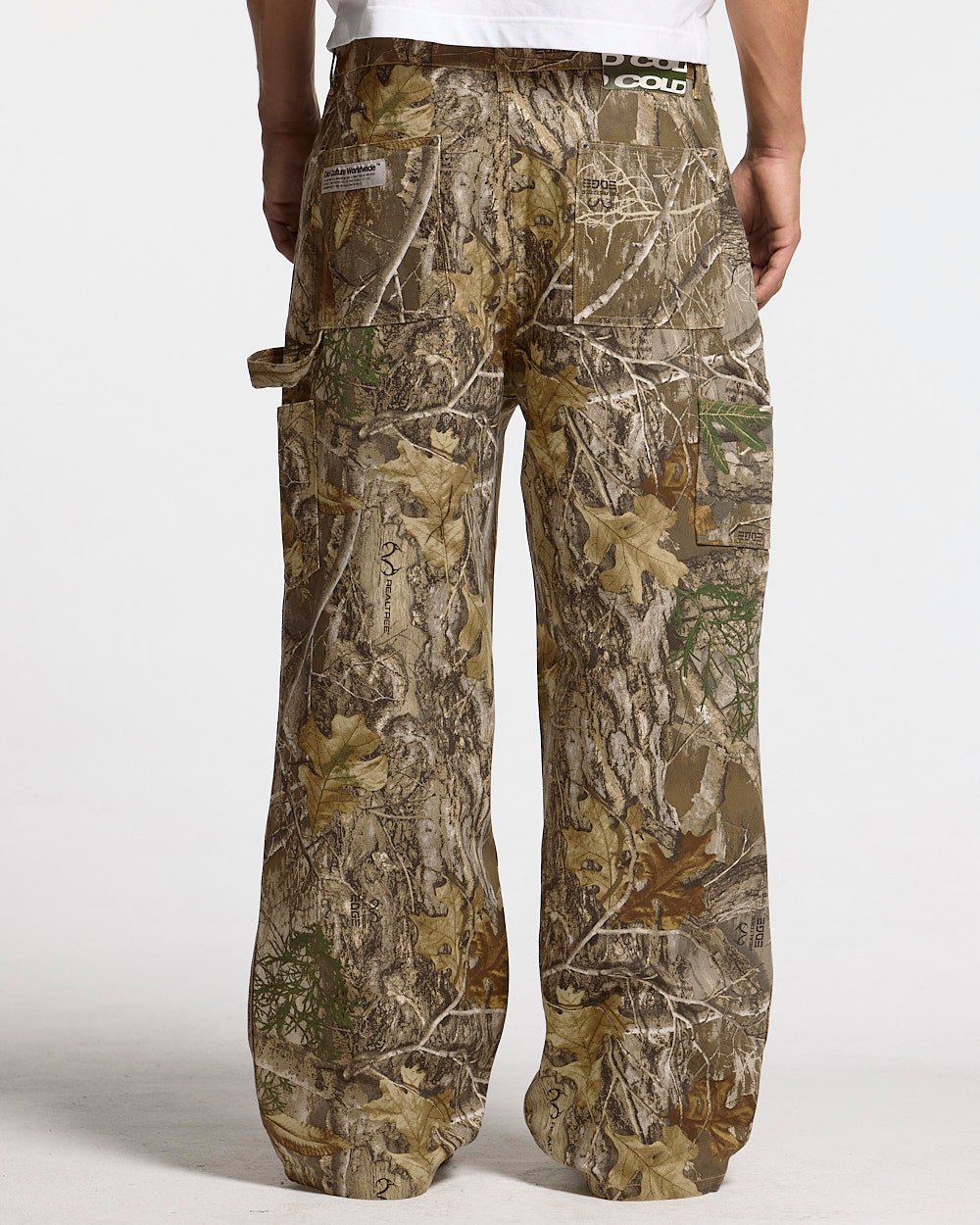 V1 CARPENTER PANTS REALTREE - realtree camo carpenter pants, back view on male model - Cold Culture