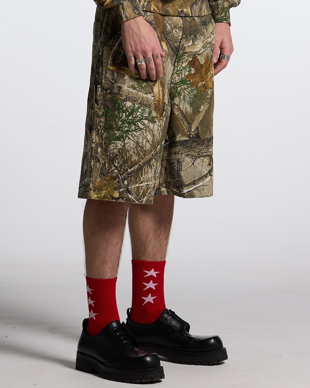 V1 CARPENTER SHORTS REALTREE - realtree camo carpenter shorts, front view on male model - Cold Culture