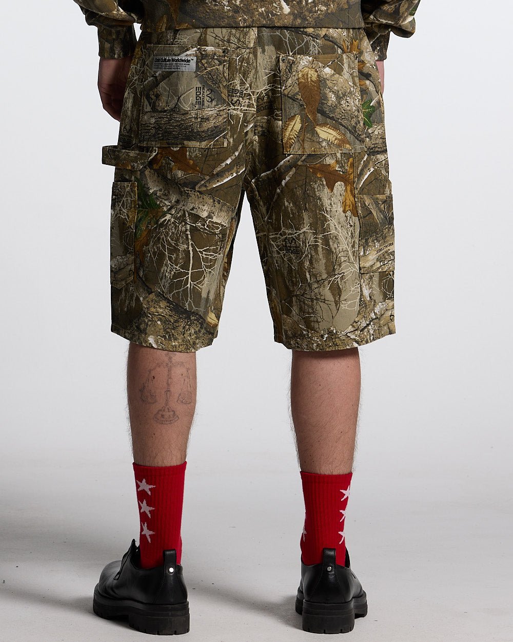 V1 CARPENTER SHORTS REALTREE - realtree camo carpenter shorts, back view on male model - Cold Culture