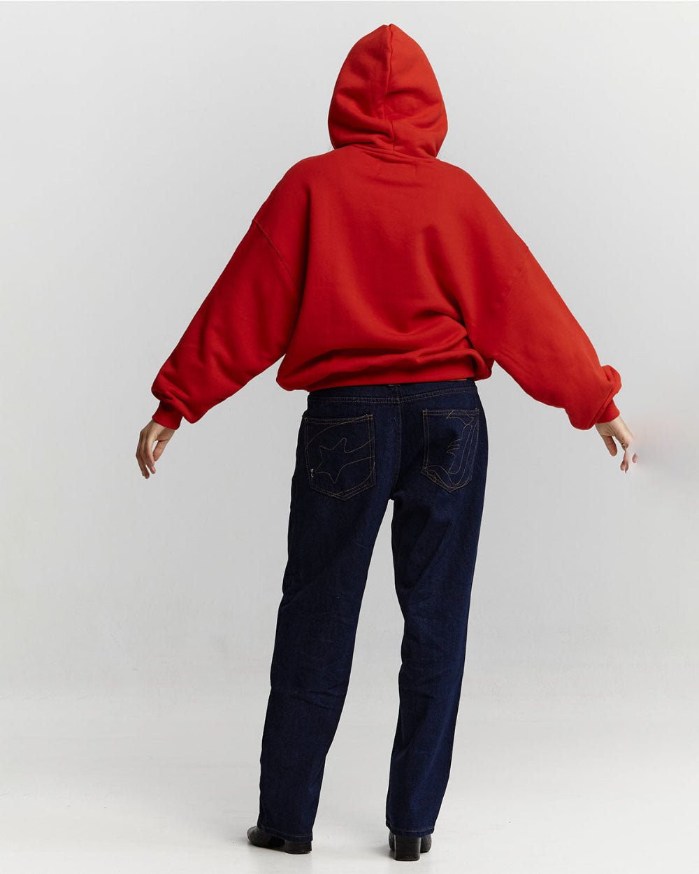 VARSITY HOODIE ASTORATH RED - red varsity hoodie, back view on female model - Cold Culture #woman
