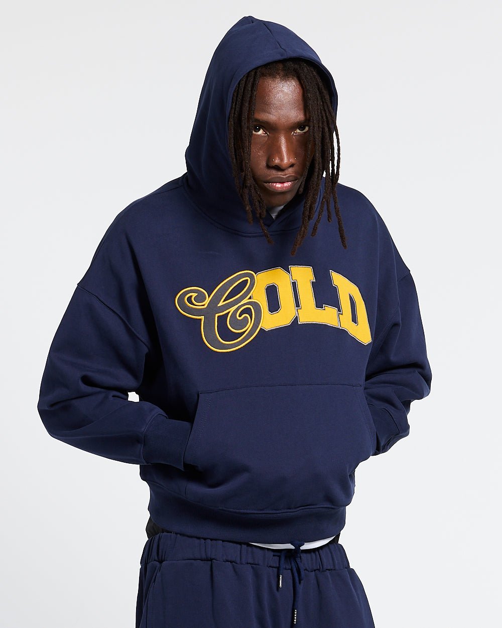 VARSITY HOODIE DARK BLUE - navy blue varsity print hoodie, front view on male model - Cold Culture #man