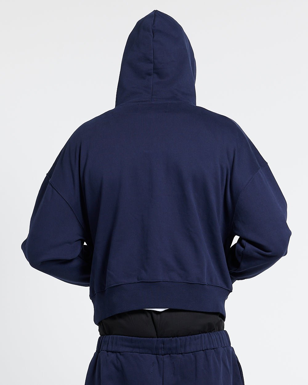 VARSITY HOODIE DARK BLUE - navy blue varsity print hoodie, back view on male model - Cold Culture