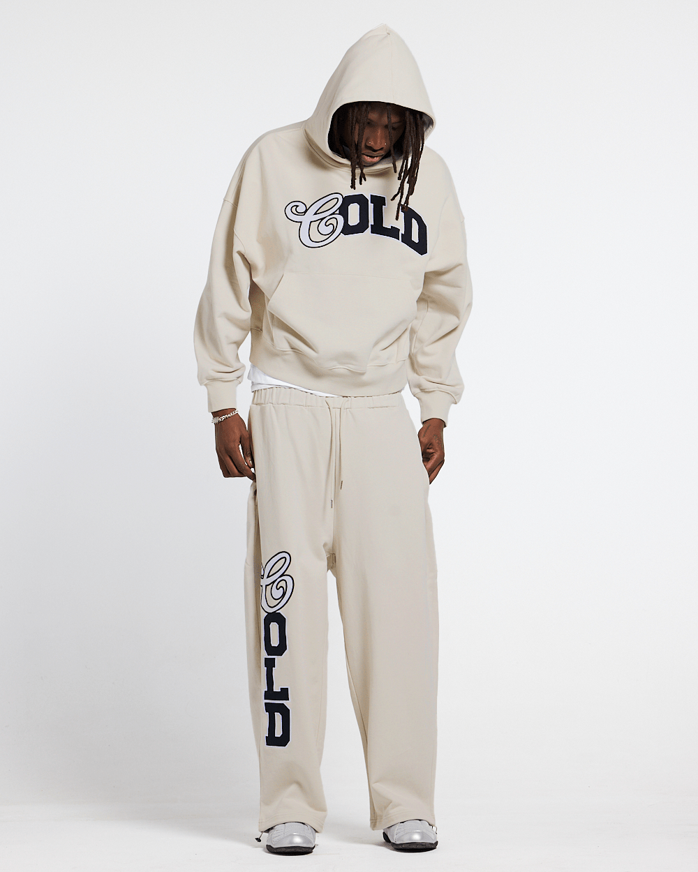 VARSITY PANTS IVORY GREY - ivory grey baggy sweatpants, front view on male model - Cold Culture #man