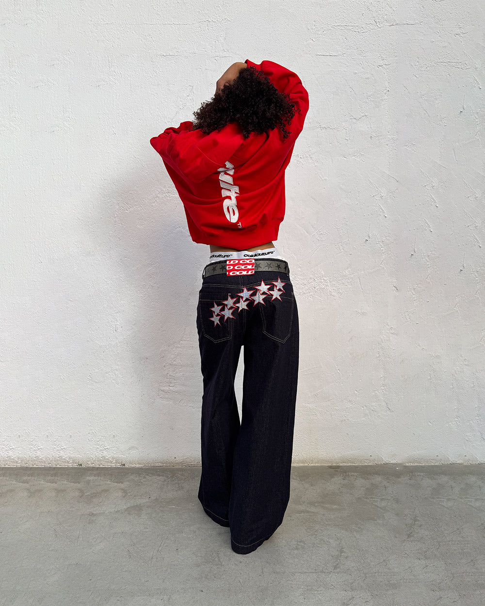 VERTICAL HOODIE RED - red oversized hoodie, back view on female model - Cold Culture