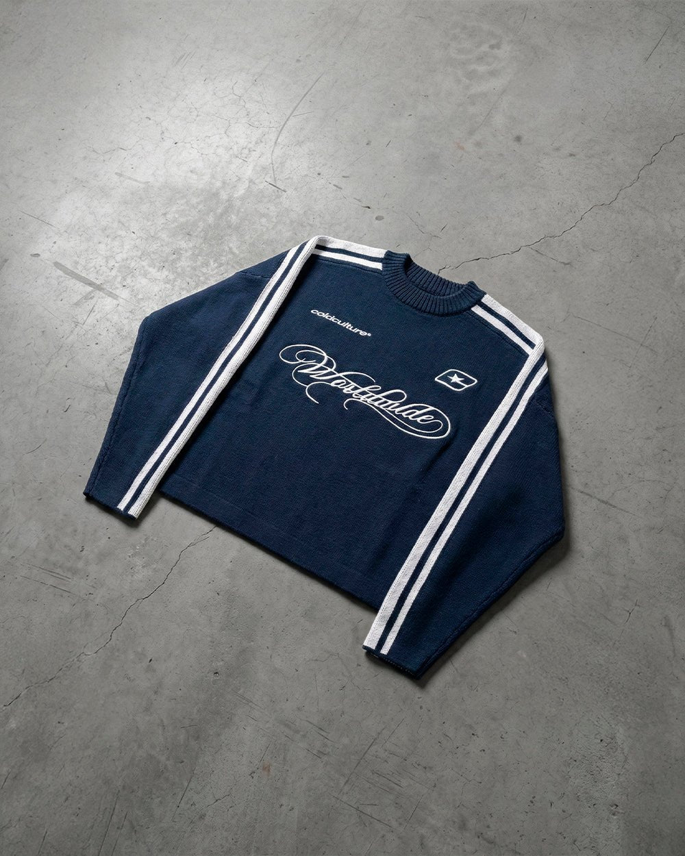 W80 KNITWEAR BLUE - navy striped knit sweater, flat lay - Cold Culture
