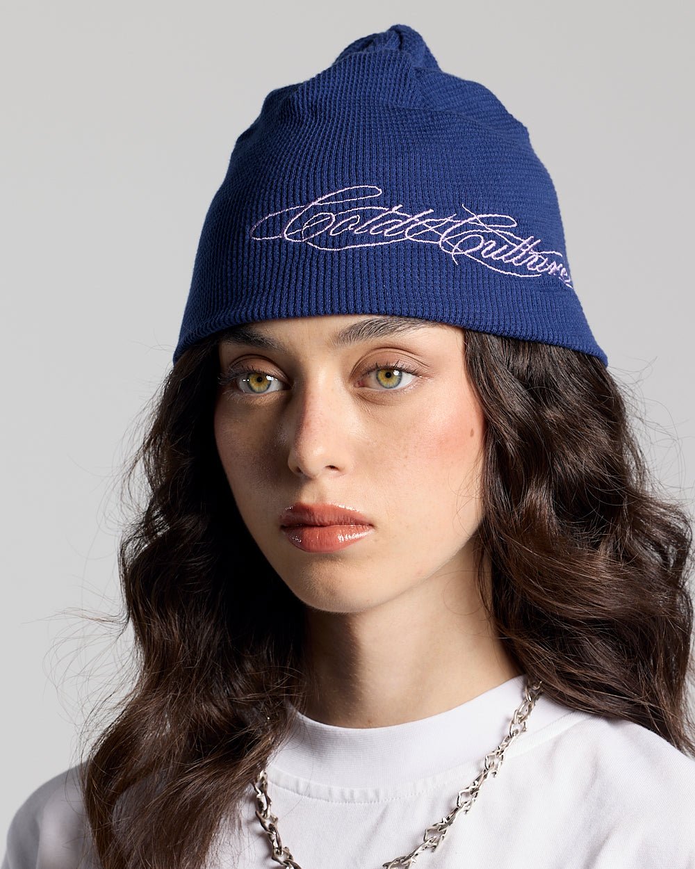 WAFFLE BEANIE BLUE - navy blue waffle knit beanie, on model close-up - Cold Culture #woman