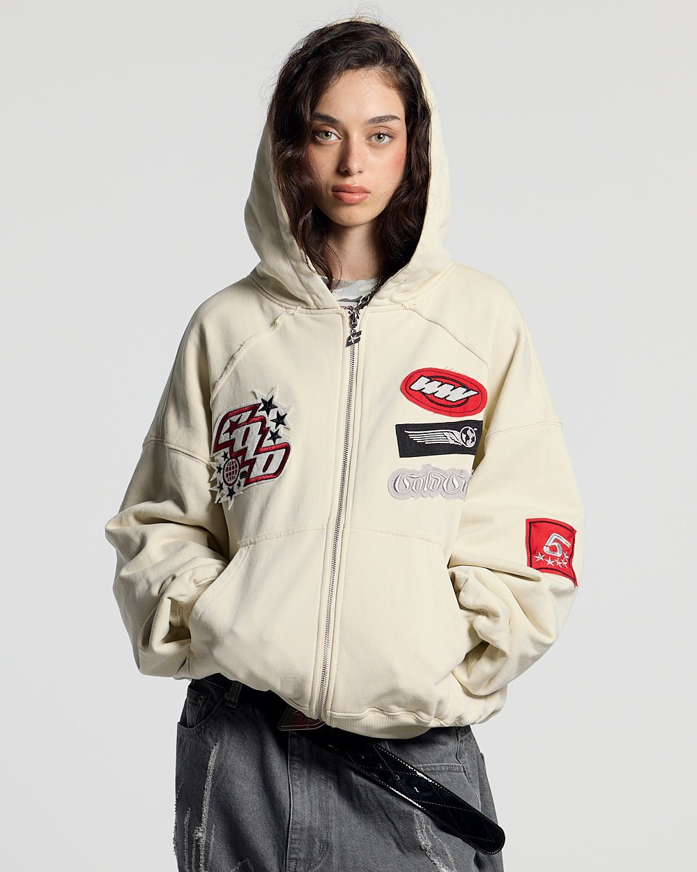 WALKER ZIP HOODIE LIGHT GREY - cream zip-up hoodie with patches, front view on female model - Cold Culture #woman