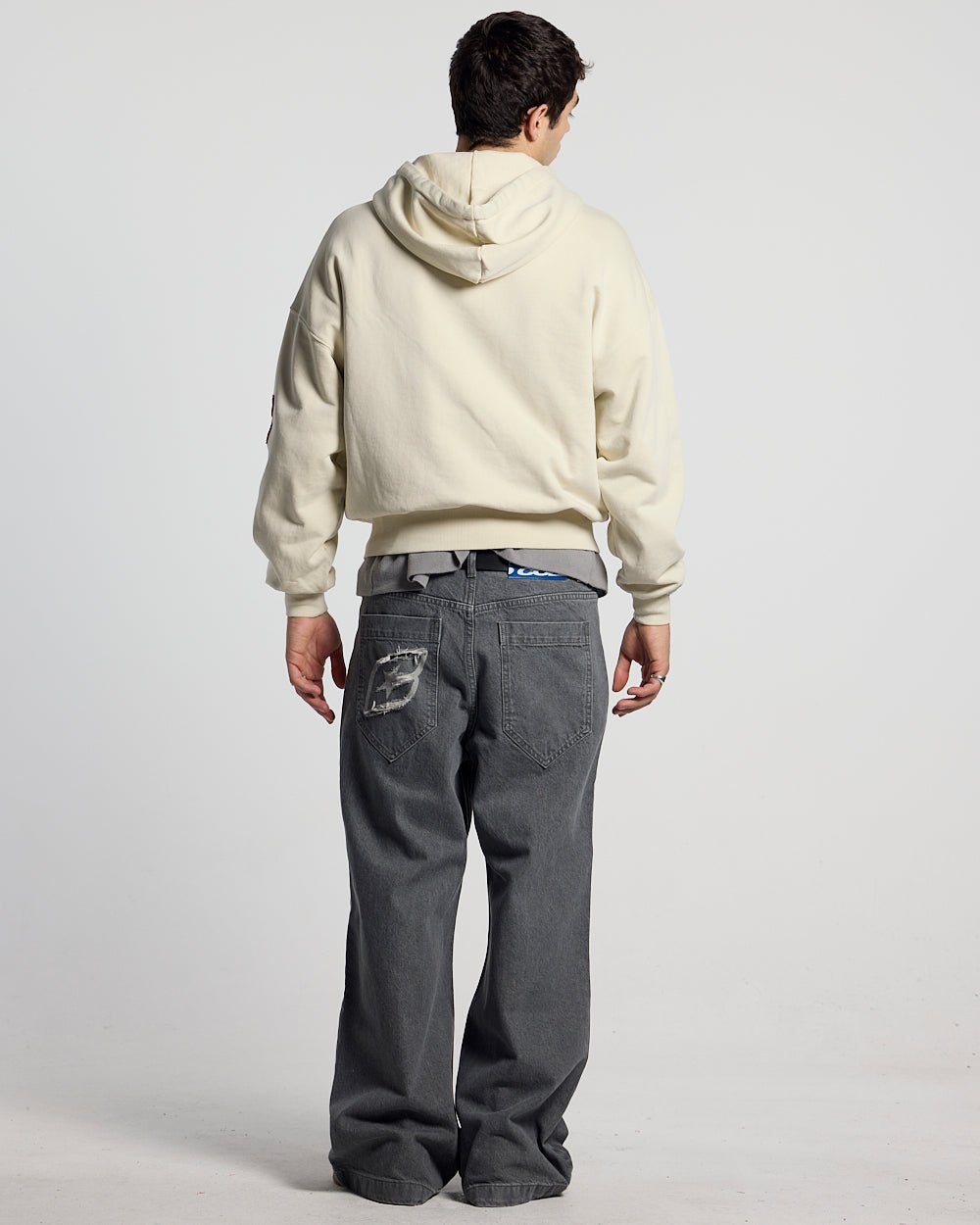 WALKER ZIP HOODIE LIGHT GREY - cream zip-up hoodie with patches, back view on male model - Cold Culture