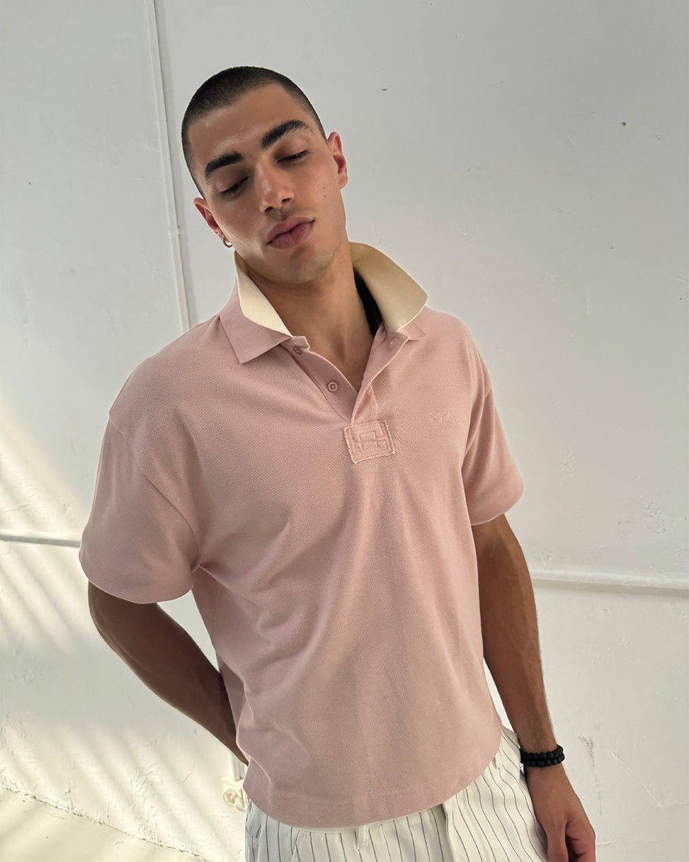 WHIP POLO PINK - pink oversized polo shirt, front view on male model - Cold Culture