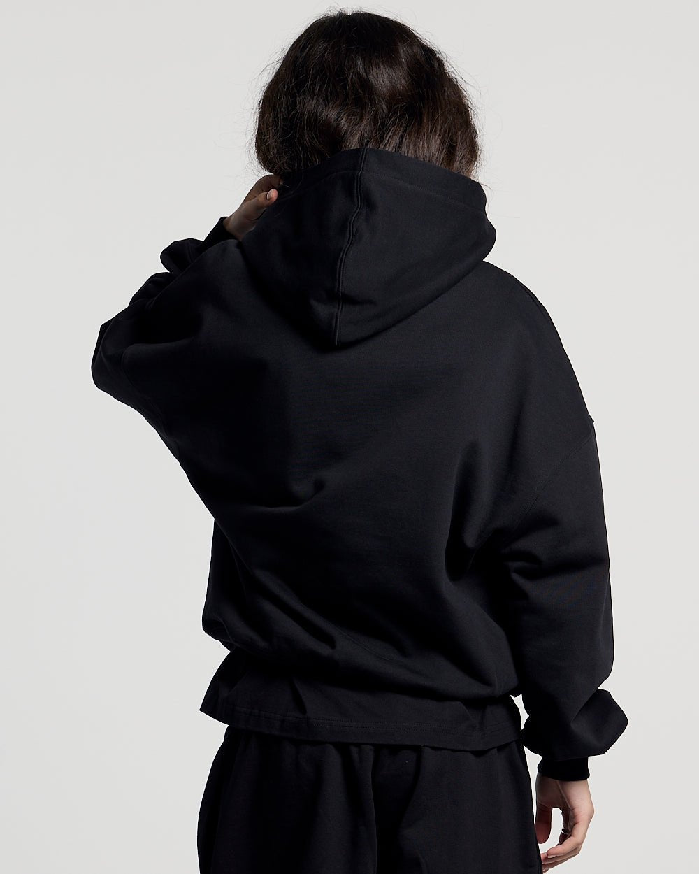 WILD CAMO HOODIE BLACK - black graphic print hoodie, back view on female model - Cold Culture #woman