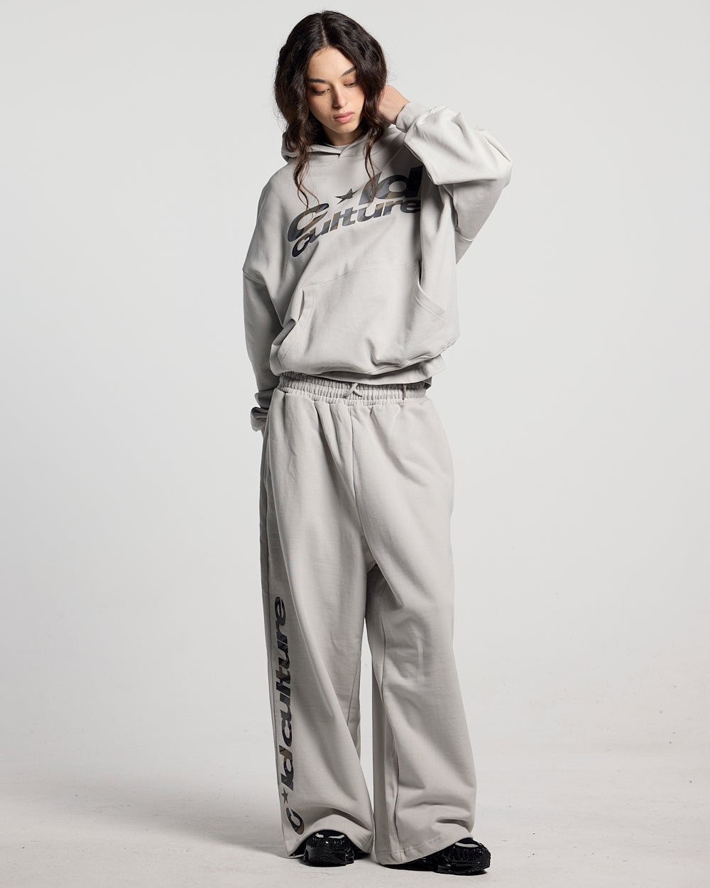 WILD CAMO SWEATPANTS LIGHT GREY - light grey baggy sweatpants, front view on female model - Cold Culture #woman