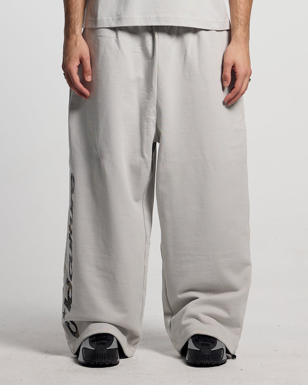 WILD CAMO SWEATPANTS LIGHT GREY - light grey baggy sweatpants, front view on male model - Cold Culture