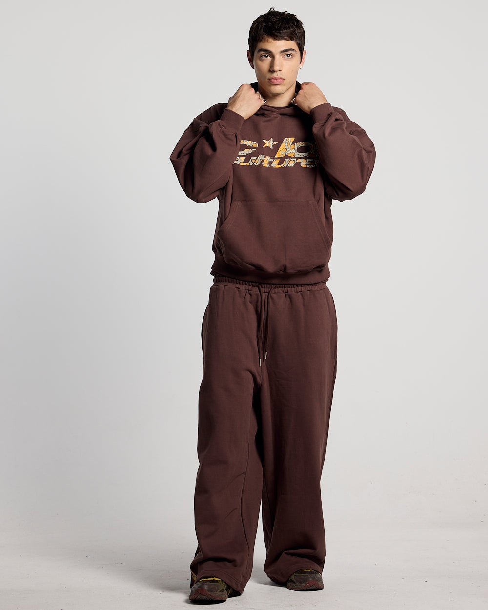 WILD SNAKE SWEATPANTS BROWN - brown baggy sweatpants, front view on male model - Cold Culture #man
