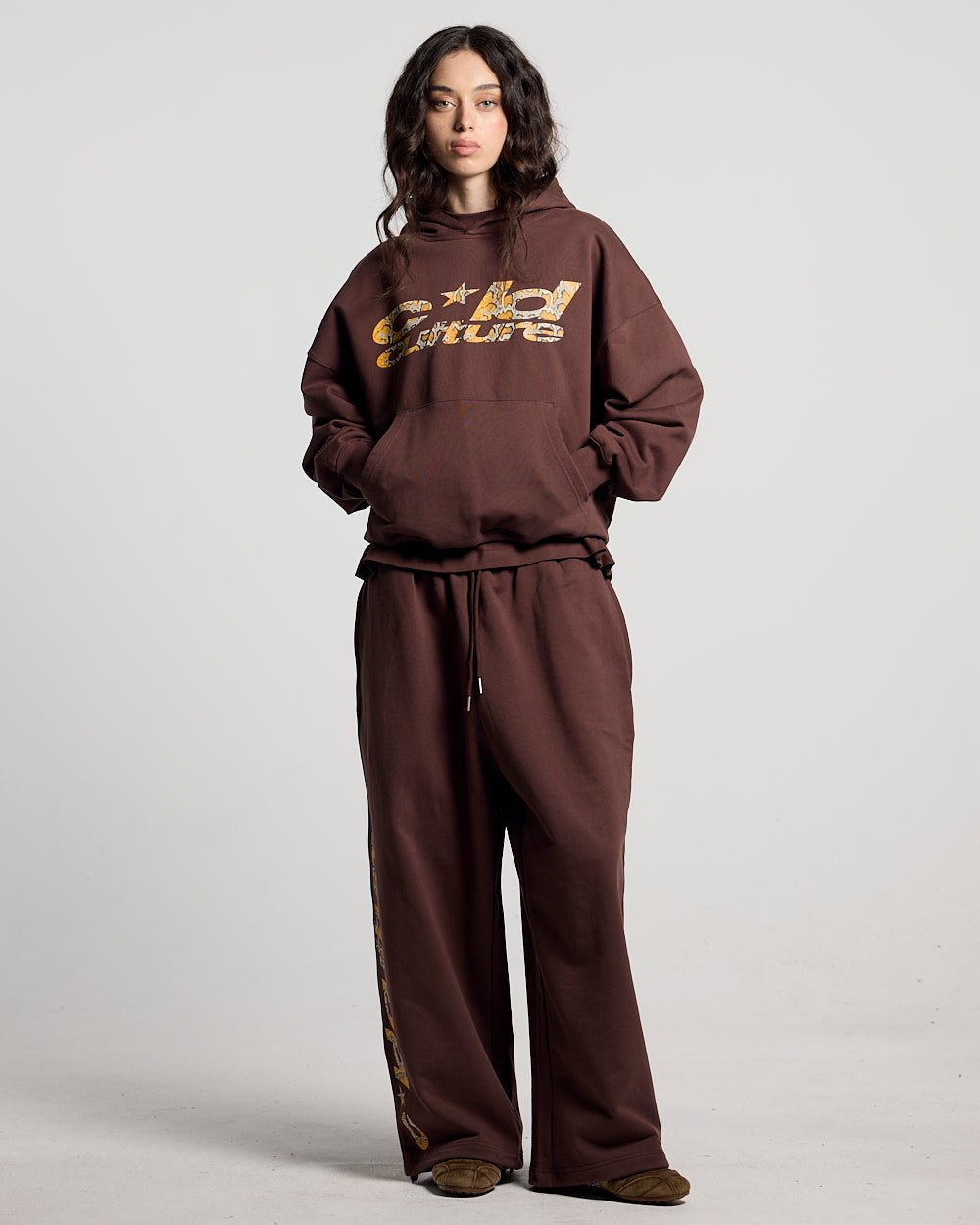 WILD SNAKE SWEATPANTS BROWN - brown baggy sweatpants, front view on female model - Cold Culture #woman