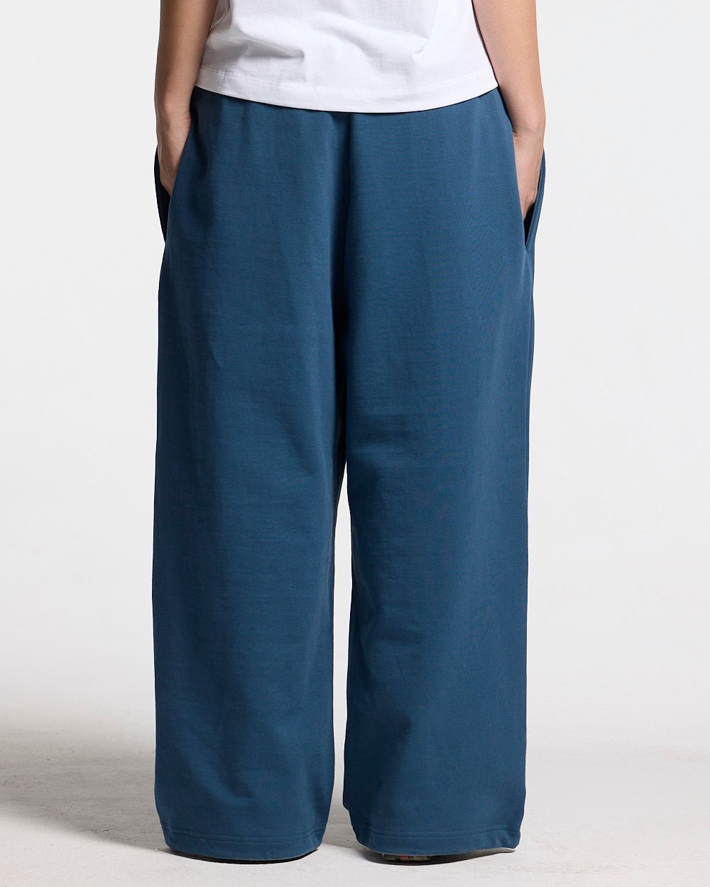 WILD SNAKE SWEATPANTS NAVY BLUE - navy blue baggy sweatpants, back view on female model - Cold Culture #woman
