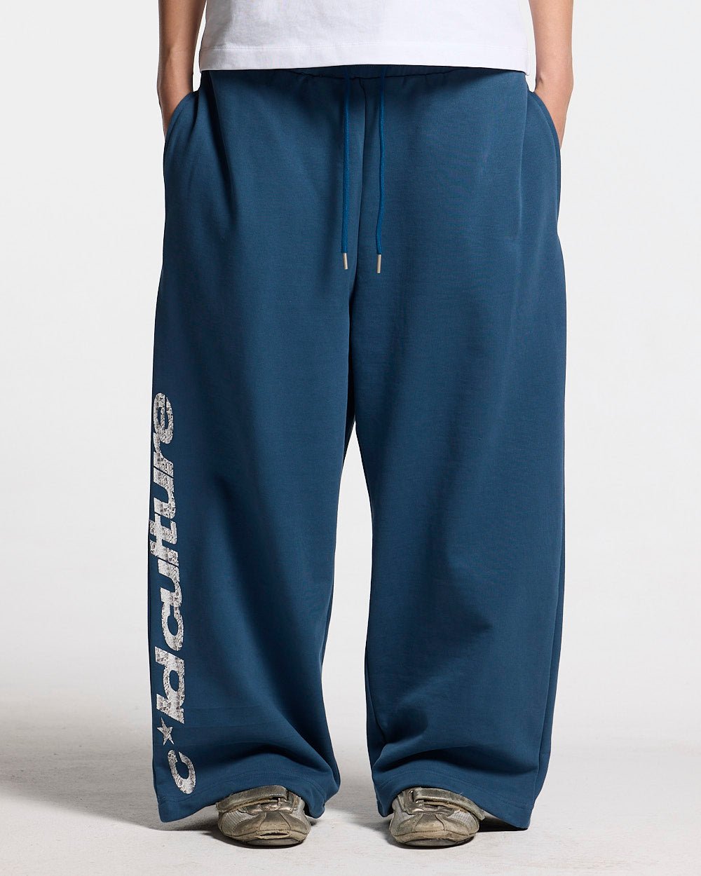 WILD SNAKE SWEATPANTS NAVY BLUE - navy blue baggy sweatpants, front view on female model - Cold Culture #woman