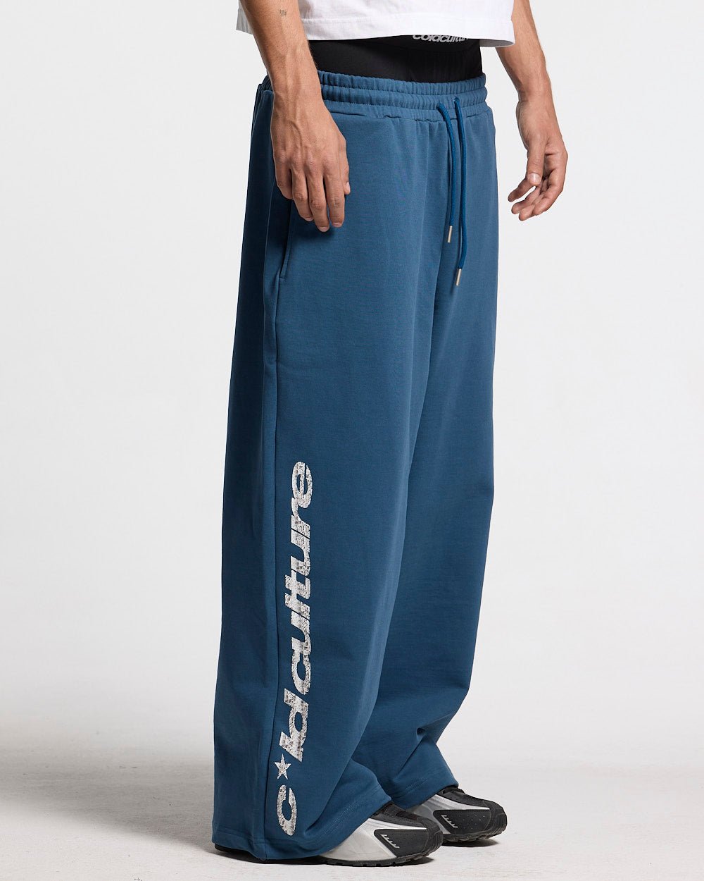 WILD SNAKE SWEATPANTS NAVY BLUE - navy blue baggy sweatpants, side view - Cold Culture