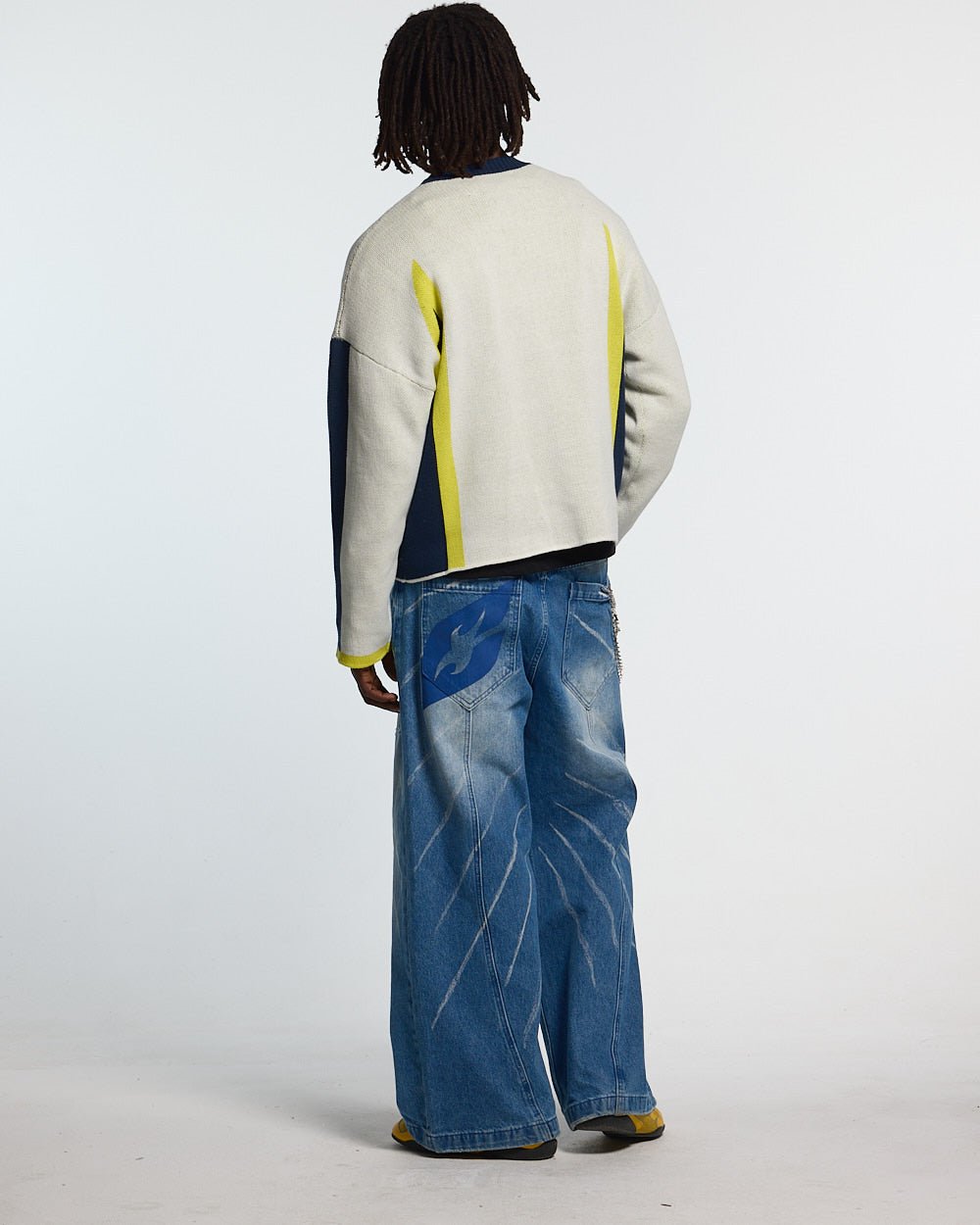 WINNER KNIT BEIGE, DARK BLUE & YELLOW - beige and navy knit sweater, back view on male model - Cold Culture #man