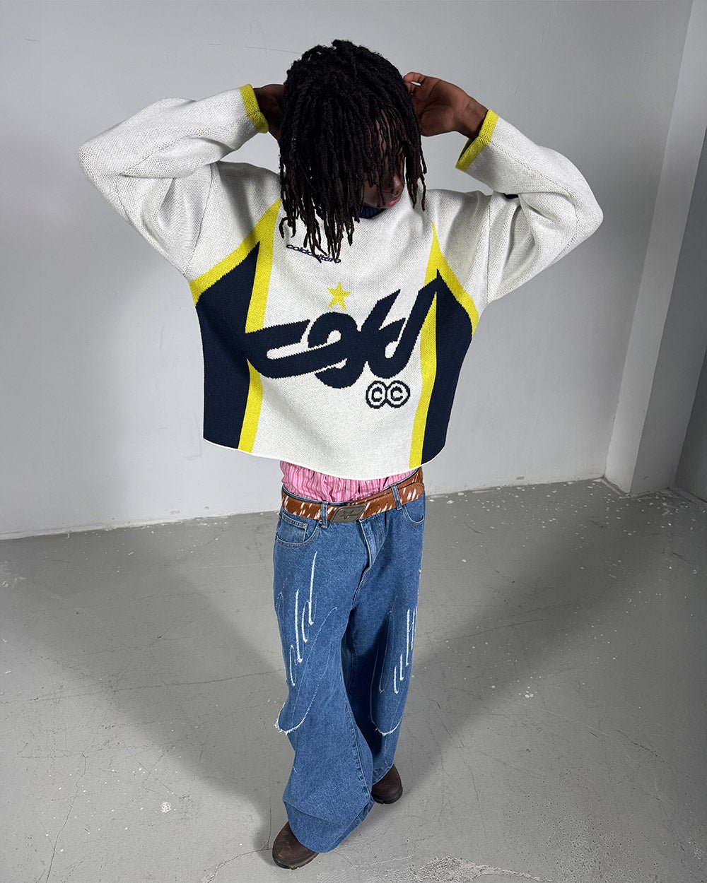 WINNER KNIT BEIGE, DARK BLUE & YELLOW - beige and navy knit sweater, back view on male model - Cold Culture