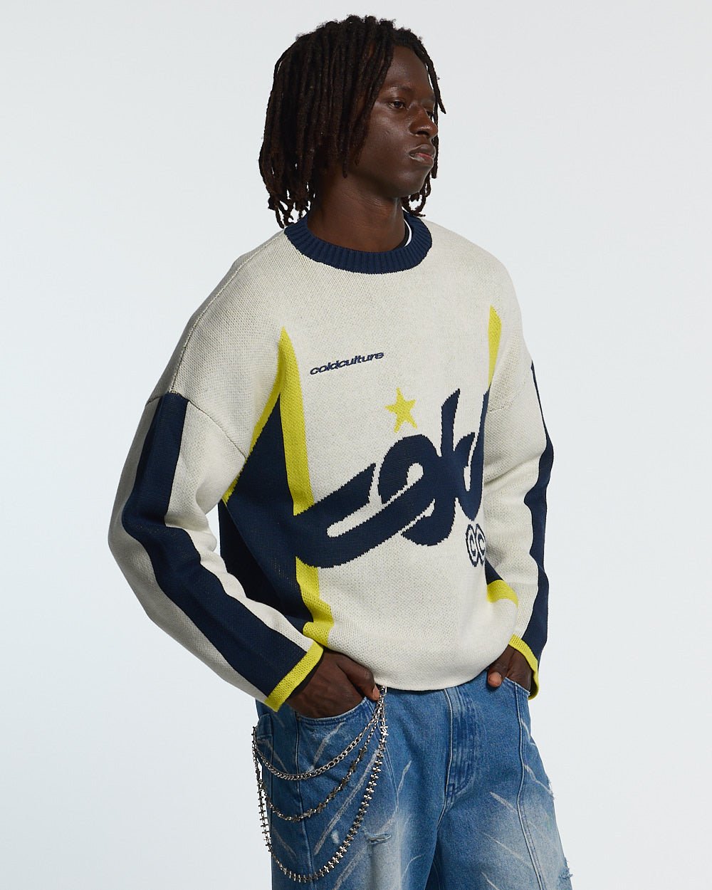 WINNER KNIT BEIGE, DARK BLUE & YELLOW - beige and navy knit sweater, front view on male model - Cold Culture #man