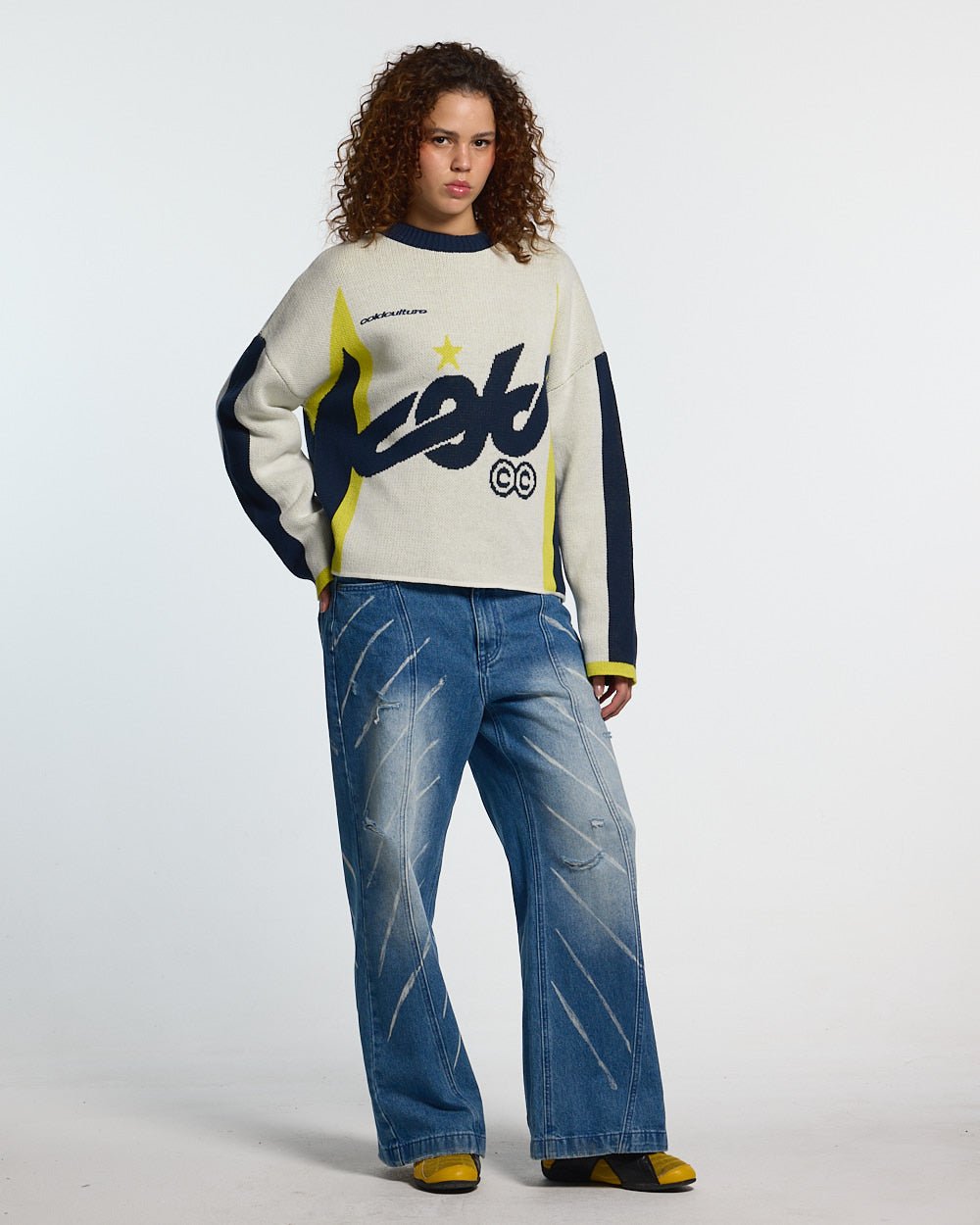 WINNER KNIT BEIGE, DARK BLUE & YELLOW - beige and navy knit sweater, front view on female model - Cold Culture #woman