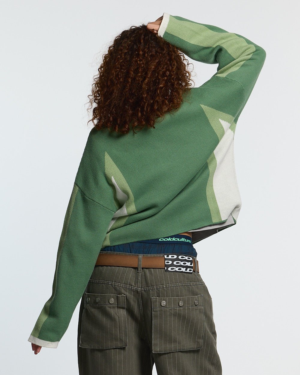 WINNER KNIT GREEN - green graphic knit sweater, back view on female model - Cold Culture #woman