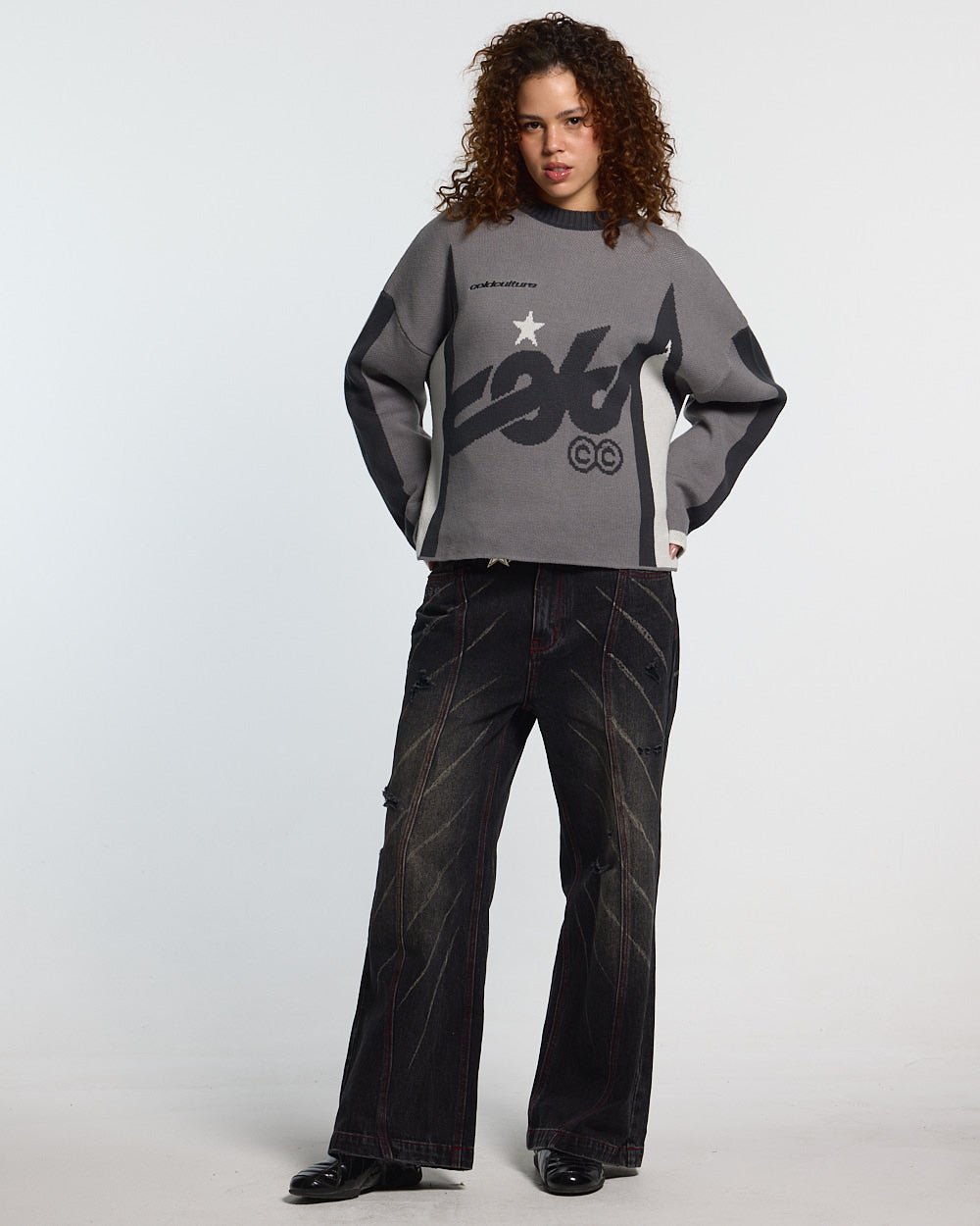WINNER KNIT GREY, BLACK AND WHITE - grey and black knit sweater, front view on female model - Cold Culture #woman