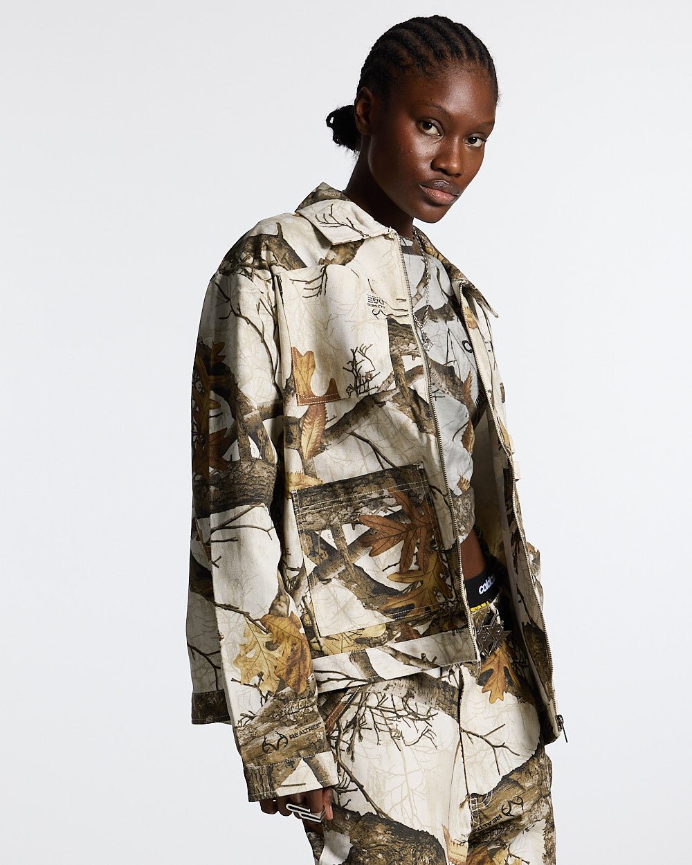 WORK ZIP JACKET REALTREE WHITE - white realtree camo work jacket, front view on female model - Cold Culture #woman