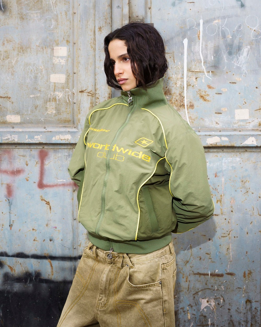 WW CLUB JACKET GREEN - olive green track jacket, street style shot - Cold Culture #woman